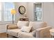 Cozy living room featuring a comfortable couch and ample natural light at 942 Byron Sw Dr, Atlanta, GA 30310