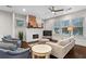 Bright living room features a brick fireplace, hardwood floors, and plenty of natural light at 942 Byron Sw Dr, Atlanta, GA 30310