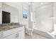 Bright bathroom with white subway tile, granite countertop and new fixtures at 1106A Wedgewood Nw Dr, Atlanta, GA 30318