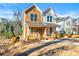 Charming two-story home featuring a welcoming front porch and a well-maintained lawn in a vibrant neighborhood at 1106A Wedgewood Nw Dr, Atlanta, GA 30318