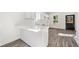 Modern kitchen featuring white cabinets, countertops, and an open layout perfect for cooking and entertaining at 1106A Wedgewood Nw Dr, Atlanta, GA 30318