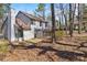 Charming two-story home with a sunroom extension and a wooded backyard at 1628 Links Overlook, Stone Mountain, GA 30088