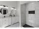 Beautiful bathroom with double sink vanity, a glass enclosed shower and white tiling at 1628 Links Overlook, Stone Mountain, GA 30088