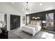 The main bedroom features natural light and a statement accent wall at 1628 Links Overlook, Stone Mountain, GA 30088