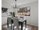 Dining area with a modern chandelier and a view of the backyard at 1628 Links Overlook, Stone Mountain, GA 30088