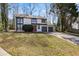 Two-story home with a two-car garage and a landscaped front yard at 1628 Links Overlook, Stone Mountain, GA 30088