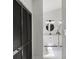 Hallway with access to the bathroom featuring double sinks and marble flooring at 1628 Links Overlook, Stone Mountain, GA 30088