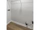 The laundry room features sleek wood-look flooring and laundry connections at 1628 Links Overlook, Stone Mountain, GA 30088