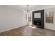 Living area with a stone fireplace and hardwood floors at 1628 Links Overlook, Stone Mountain, GA 30088