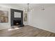 The living area has hardwood flooring, a fireplace, and is surrounded by windows for natural light at 1628 Links Overlook, Stone Mountain, GA 30088