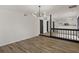 Bright living room features hardwood floors and a modern light fixture at 1628 Links Overlook, Stone Mountain, GA 30088
