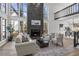 Bright living room with a fireplace, tall windows, and hardwood floors at 1628 Links Overlook, Stone Mountain, GA 30088