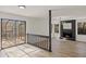 Open living area with fireplace, access to sunroom, and hardwood flooring at 1628 Links Overlook, Stone Mountain, GA 30088