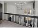 Loft area overlooking the living room with natural light and modern ceiling fan at 1628 Links Overlook, Stone Mountain, GA 30088