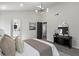 Bright bedroom features hardwood floors and a modern light fixture at 1628 Links Overlook, Stone Mountain, GA 30088