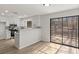 Sunroom access off of a modern kitchen with an open fireplace concept at 1628 Links Overlook, Stone Mountain, GA 30088