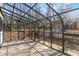 Enclosed sunroom with a tile floor has beautiful natural lighting and outdoor views at 1628 Links Overlook, Stone Mountain, GA 30088