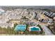 Beautiful aerial view of community featuring pool and tennis courts, surrounded by mature trees and well-maintained homes at 4916 Kentwood Dr, Marietta, GA 30068