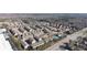 Wide aerial view of a residential neighborhood showcasing a community pool, tennis courts and surrounding homes at 4916 Kentwood Dr, Marietta, GA 30068