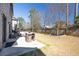 Serene backyard featuring a patio with outdoor seating and a well-maintained lawn for relaxing and enjoying the outdoors at 4916 Kentwood Dr, Marietta, GA 30068