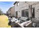 Spacious patio in backyard featuring stylish outdoor furniture, perfect for relaxation and entertaining guests at 4916 Kentwood Dr, Marietta, GA 30068