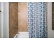 Inviting bathtub and shower area with sleek fixtures and stylish curtain, creating a spa-like experience at 4916 Kentwood Dr, Marietta, GA 30068