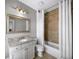 Bathroom features vanity, granite countertops, modern fixtures, and a tub with tile surround and shower at 4916 Kentwood Dr, Marietta, GA 30068