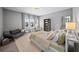 Comfortable bedroom with a queen bed, large windows, with good natural light and stylish, modern decor at 4916 Kentwood Dr, Marietta, GA 30068