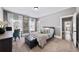 Bedroom featuring neutral paint, carpet floors, windows with drapes and view to an ensuite bathroom at 4916 Kentwood Dr, Marietta, GA 30068