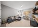 Bonus room offering carpet floors, TV, furniture and window for natural light at 4916 Kentwood Dr, Marietta, GA 30068