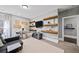 Bonus room featuring gray paint, carpet floors, TV, furniture, natural light and interesting shelving at 4916 Kentwood Dr, Marietta, GA 30068