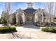 Inviting clubhouse with stone accents, a welcoming entrance, and manicured landscaping at 4916 Kentwood Dr, Marietta, GA 30068