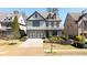 Beautiful two-story home with a two-car garage, covered front porch, and meticulously landscaped front yard at 4916 Kentwood Dr, Marietta, GA 30068