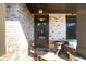 Elegant front entry featuring a covered porch with stone accents, sophisticated door, and charming decor at 4916 Kentwood Dr, Marietta, GA 30068