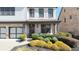 Lovely two-story home featuring a welcoming covered porch with decorative landscaping, perfect for relaxation at 4916 Kentwood Dr, Marietta, GA 30068