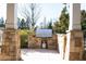 Built in gas grill on outdoor patio with stone pillars at 4916 Kentwood Dr, Marietta, GA 30068