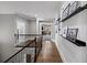 Upstairs hallway features hardwood floors, picture ledges, and a view into another room of the house at 4916 Kentwood Dr, Marietta, GA 30068