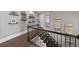 Upper hallway boasts hardwood floors and decorative wall art, seamlessly connecting the living spaces at 4916 Kentwood Dr, Marietta, GA 30068