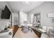 Bright home office features modern furnishings, a large mirror, and stylish decor for an inspiring workspace at 4916 Kentwood Dr, Marietta, GA 30068