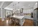 Spacious kitchen with island seating, stainless appliances, and modern lighting at 4916 Kentwood Dr, Marietta, GA 30068