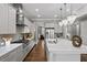 Bright and modern kitchen with a large island, stainless steel appliances, and modern lighting at 4916 Kentwood Dr, Marietta, GA 30068