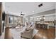 Open concept living room leading into a kitchen with hardwood flooring and neutral decor at 4916 Kentwood Dr, Marietta, GA 30068