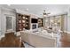 Cozy living room featuring a fireplace, built-in shelves, and stylish furniture at 4916 Kentwood Dr, Marietta, GA 30068