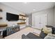 Cozy living room with floating shelves, modern furnishings, and a neutral color palette for a relaxing ambiance at 4916 Kentwood Dr, Marietta, GA 30068