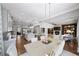 An open concept living space with dining room table, modern lighting, and decor at 4916 Kentwood Dr, Marietta, GA 30068