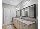 Elegant main bathroom with a double vanity, granite countertops, and modern fixtures with tile floors at 4916 Kentwood Dr, Marietta, GA 30068
