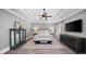 Beautiful main bedroom with tray ceilings, a large bed, and stylish decor with a large television at 4916 Kentwood Dr, Marietta, GA 30068