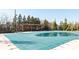 Community pool is covered for the off season, and is surrounded by mature trees at 4916 Kentwood Dr, Marietta, GA 30068