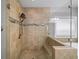 Modern walk-in shower with seamless glass enclosure and decorative mosaic tile accents throughout the bathroom at 4916 Kentwood Dr, Marietta, GA 30068