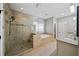 Modern bathroom featuring a glass-enclosed shower and separate soaking tub with decorative tile work at 4916 Kentwood Dr, Marietta, GA 30068